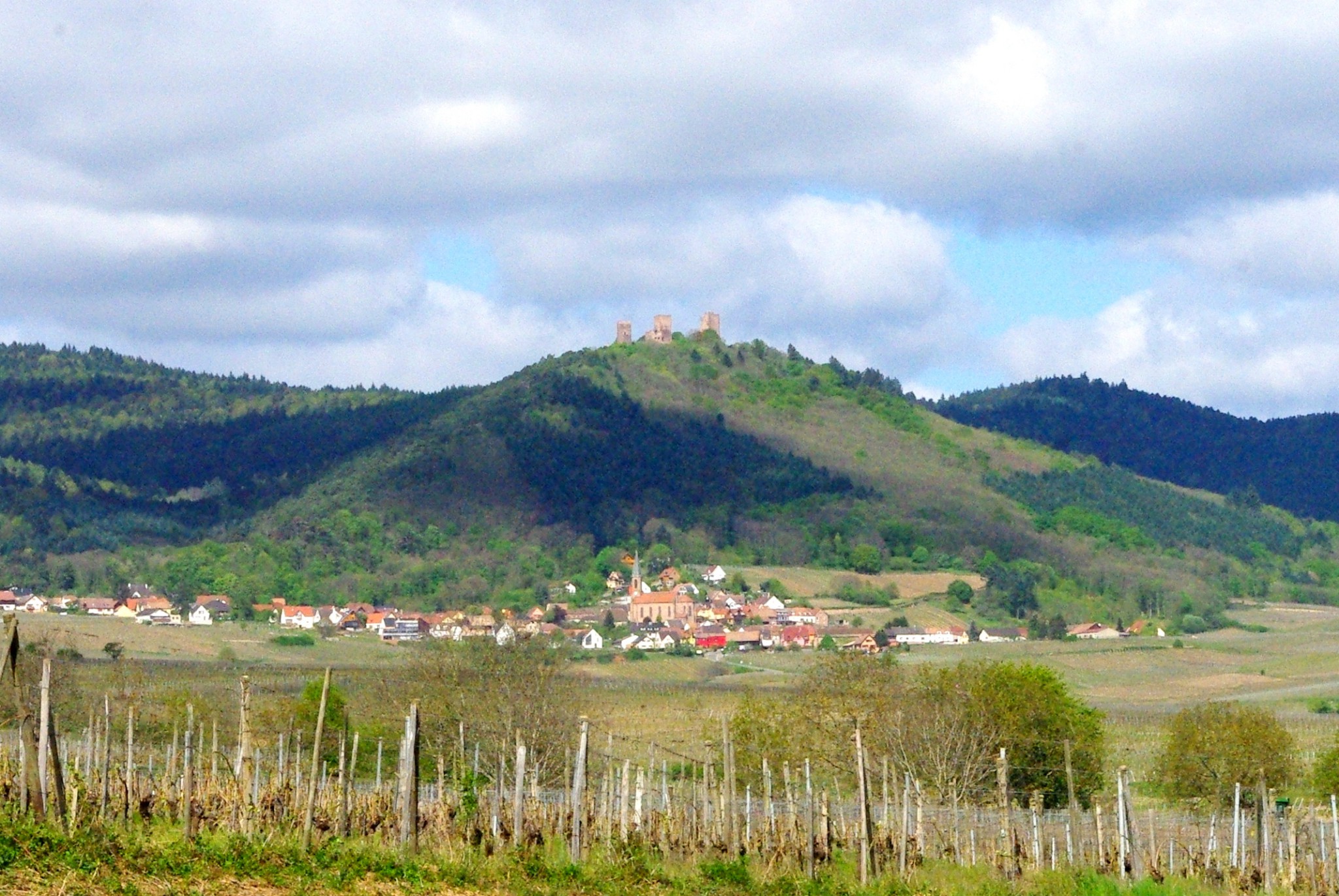 The three castles of Eguisheim seen from the vineyards © French Moments