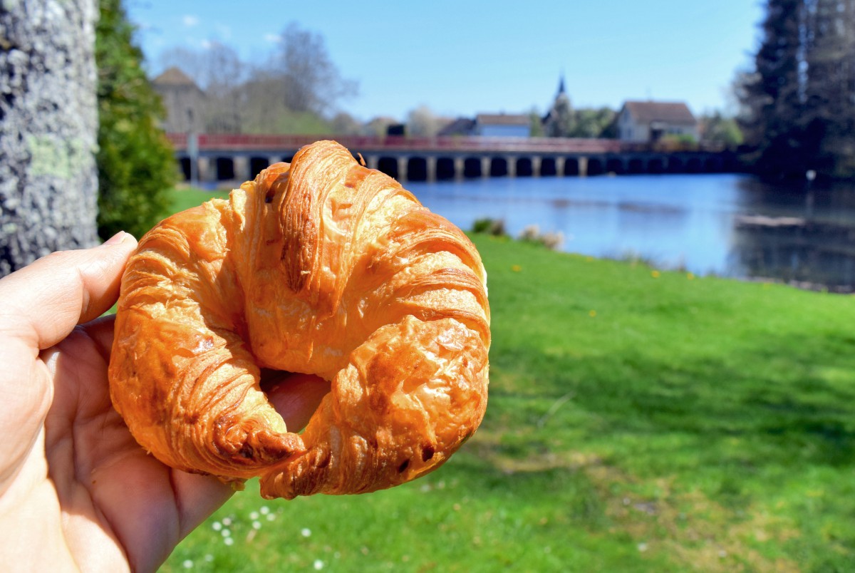 About to eat a French croissant near Lure (Haute-Saône) © French Moments