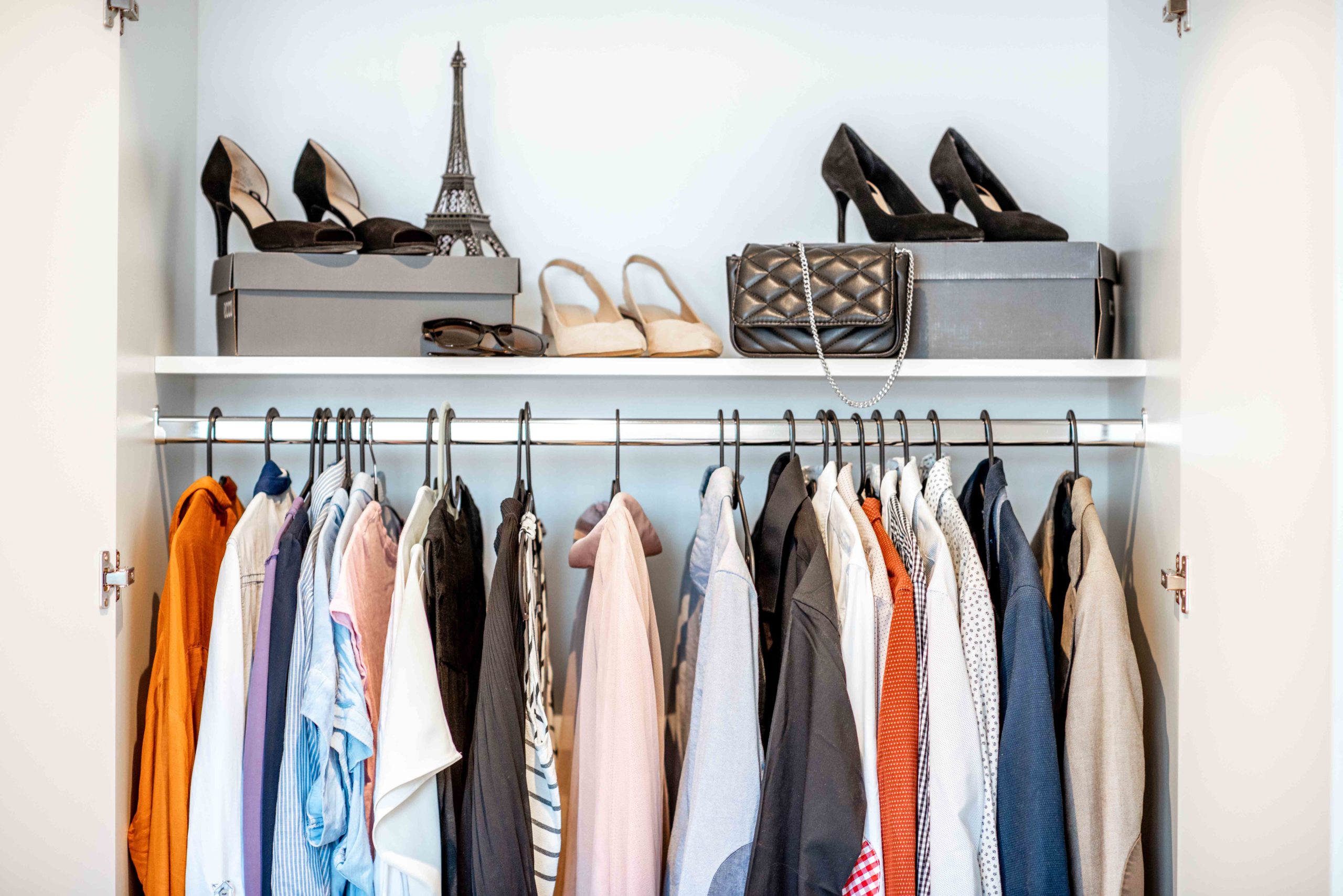 Clothes in the wardrobe. Photo by RossHelen via Envato Elements