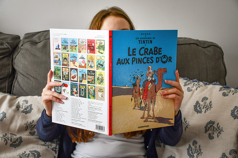 Aimée reads Tintin