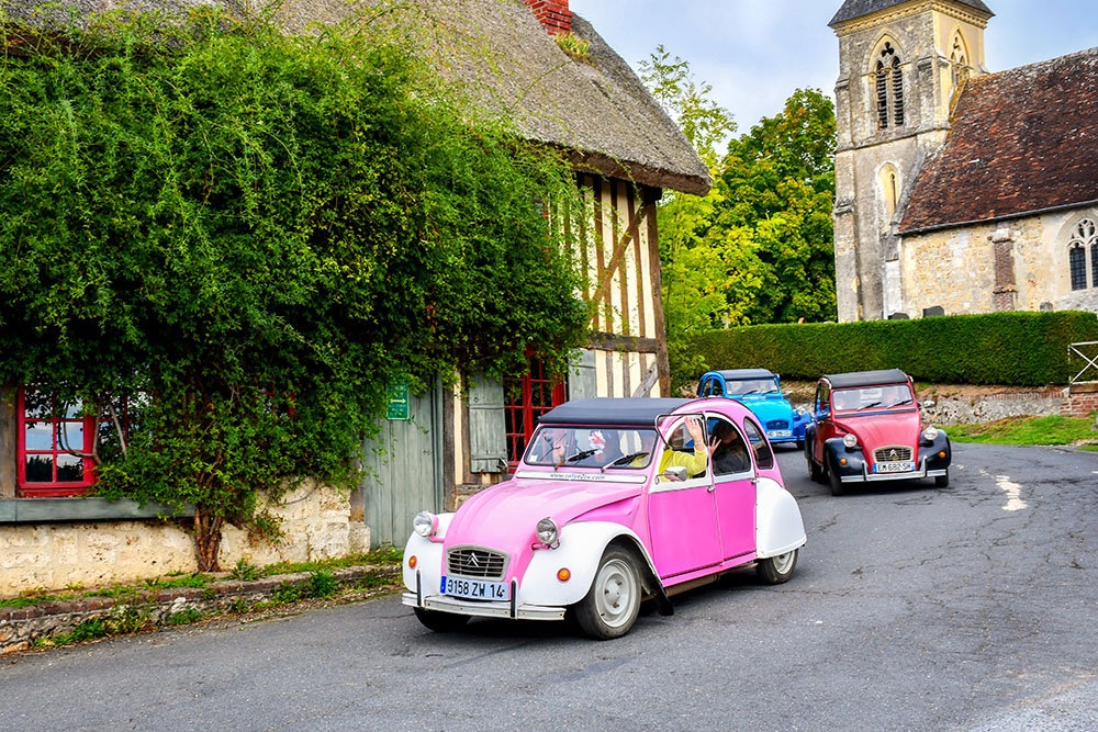 A rally of Citroen 2CV in the Pays d'Auge