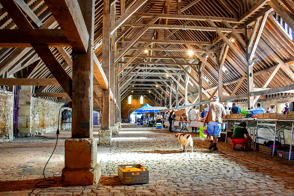 The medieval hall of Saint-Pierre-sur-Dives hosts the market on Monday morning